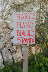 Acces beach sign in different languages