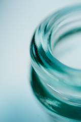 the neck of a blue glass bottle. Conceptual background. containers for alcoholic beverages