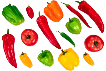 A variety of various types of peppers isolated on white. Organic fresh vegetables