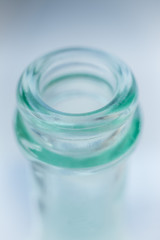 the neck of a blue glass bottle. Conceptual background. containers for alcoholic beverages