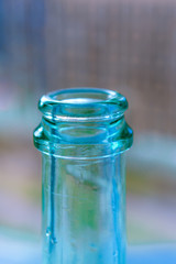 the neck of a blue glass bottle. Conceptual background. containers for alcoholic beverages