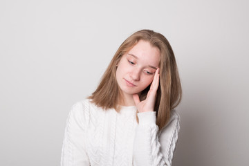 Pensive young girl. Positive caucasian teen girl.
