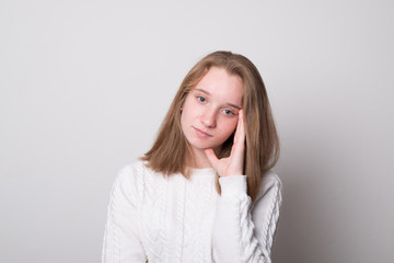 Pensive young girl. Positive caucasian teen girl.