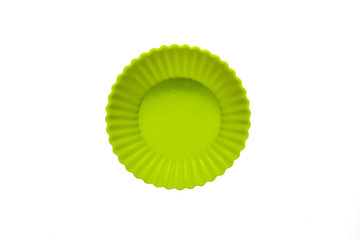 Green silicone cupcake baking dish isolated on white background