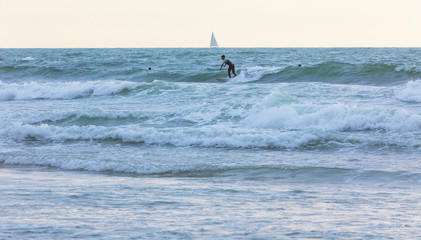Surfer rides the waves of the Mediterranean Sea