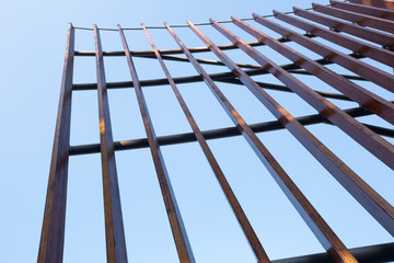 The texture of the wooden structure, vertical lines against the blue sky. 01.2020 Milan
