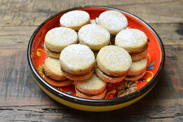 Vanilice, traditional serbian vanilla cookies on the red pottery plate