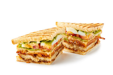 Two slices of club sandwich on white