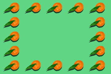 Tangerines with green leaf pattern on light green background.