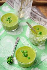 Cream of Green Pea Soup Garnished with Fresh Peas