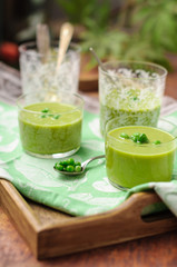 Cream of Green Pea Soup Garnished with Fresh Peas