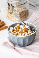 Bowl of oatmeal porridge with cinnamon.