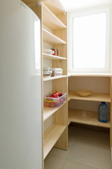 Fototapeta na wymiar Food storage, wooden shelves in the pantry, kitchen utensils