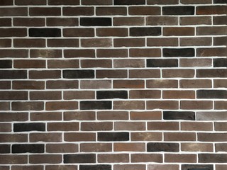 Obraz premium Brick wall in brown tones of different colors. Background for design and decoration.