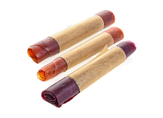 Sweet pureed fruit pastille. Natural sweets from dried berries and fruits, mix of raspberries, currants, apples, strawberries and pumpkins. Healthy snack food, natural nutrition for kids.