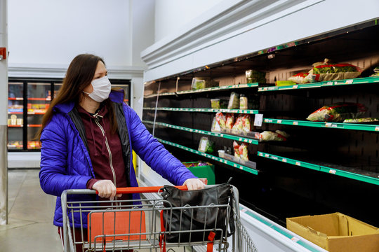 Woman with protection face mask and gloves shopping at supermarket.