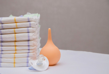 Baby diapers in a stack on a white background. Hygiene of the baby.