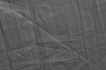 dark background: Crumpled fabric, black and white, enhanced contrast