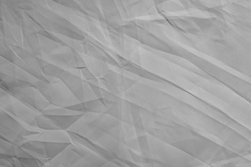 light background: Crumpled fabric, black and white, enhanced contrast