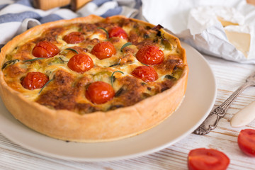 pie with  cheese brie and cherry tomatoes - Powered by Adobe