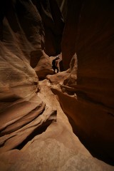 Young Female Hiking Exploring a Red Rock Sandstone Slot Canyon