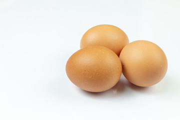 Three Chicken Eggs Isolated Above White Background
