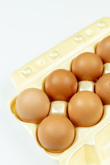 Full box with eggs isolated above white background with copy space