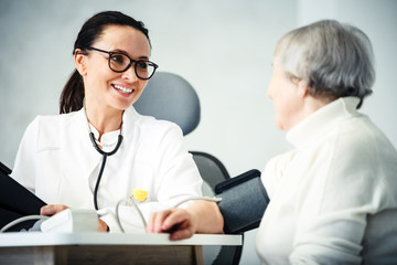 Fototapeta premium healthcare in hospital concept. female doctor consulting old lady