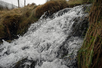 Small river cascade, Frozen motion, natural abstract texture background.