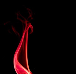 Red smoke on black background