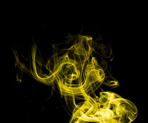 Yellow smoke on black background