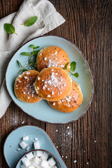 Bath buns, classic English sweet pastry glazed with syrup, topped with caraway seeds and crushed sugar cubes