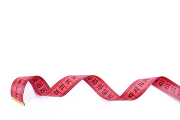 slim concept. red measuring tape isolated on a white background. healthy eating concept.