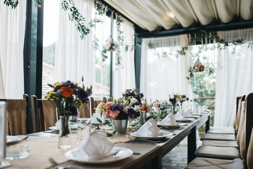  Decorated tables with candles and floral arrangements for celebration