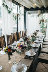  Decorated tables with candles and floral arrangements for celebration
