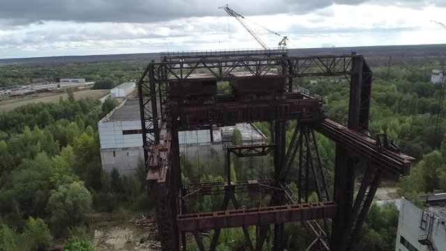 KP-640 crane. They load the reactors in the power units. Rusty tap. Near the city of Pripyat. Video from the drone. Unfinished 5th power unit of the Chernobyl nuclear power plant. Rare footage. Destru