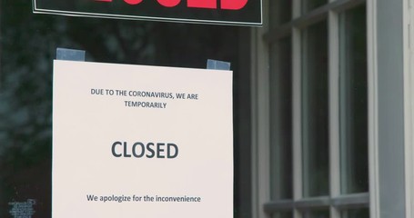 A small business sign on the storefront window closed because of coronavirus or COVID19.