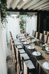  Decorated tables with candles and floral arrangements for celebration