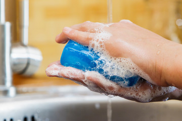 Water flows on children's hands