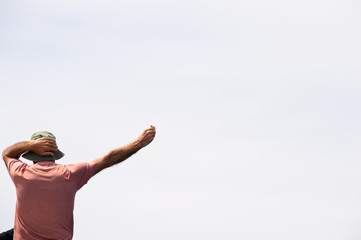 Aman with a cookie waiting for a seagull