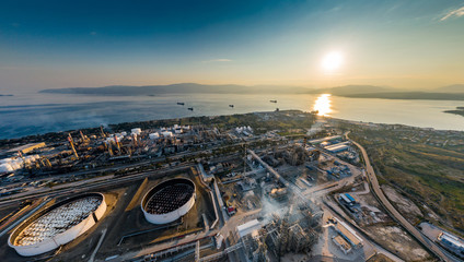 Aerial view of Chemical plant at sunset, oil refining, smoke, pipes, ecology pollution, air...