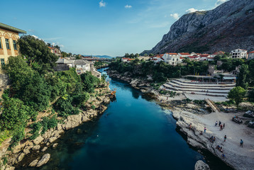 View from Old Bridge over Neretva river, foremost landmark of Old Town of Mostar, Bosnia and Herzegovina