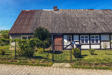 Fototapeta na wymiar Old traditional house in Lacko village within Slawno County near Baltic Sea coast, Poland