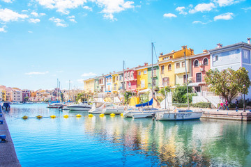 Obraz premium Port Sa Playa, Valencia, Spain - 3/19/2019: Bright sunny day photo looking at Port Saplaya, Valencia's Little Venice