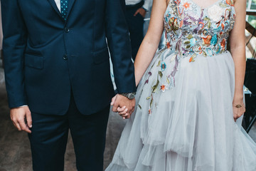  The bride in a beautiful dress and the groom in a suit on their wedding day