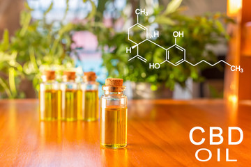 Four glass vials of Cannabidiol oil - hemp oil extrac.