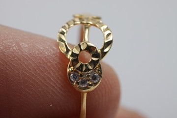 Macro shot of gold ring jewelry on an isolated background