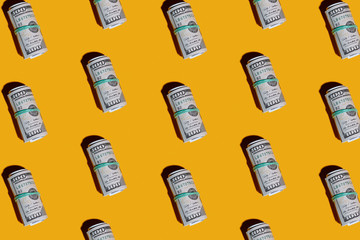 money isolated on yellow background , concept with copy space . Roll of one hundred dollar bills. 100 USD American Dollars currency. Design concept with empty space for your design