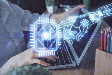 Double exposure of woman hands working on computer and data theme hologram drawing. Tech concept.