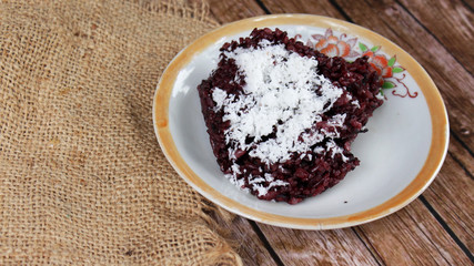 Black sticky rice or Ketan Hitam (Indonesian Name) with grated coconut, very delicious and sweet
